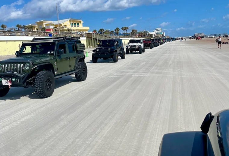 Many jeeps on the beach