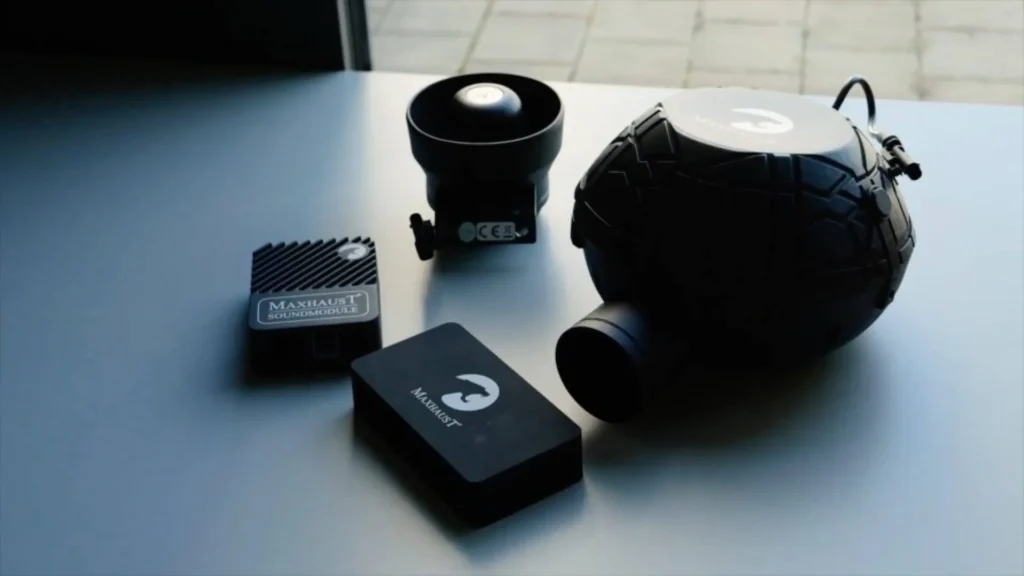 Maxhaust sound booster products displayed on a clean surface